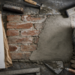 Cuvelage mur, outils maçon et mur enduit